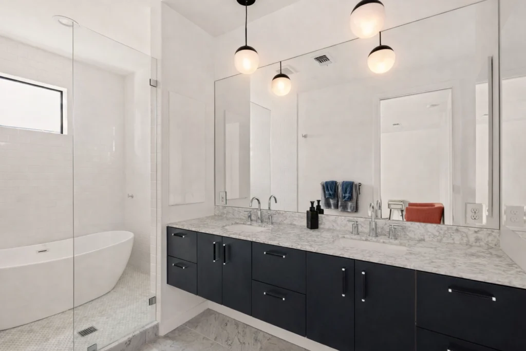 Luxury bathroom renovation with double vanity and freestanding tub
