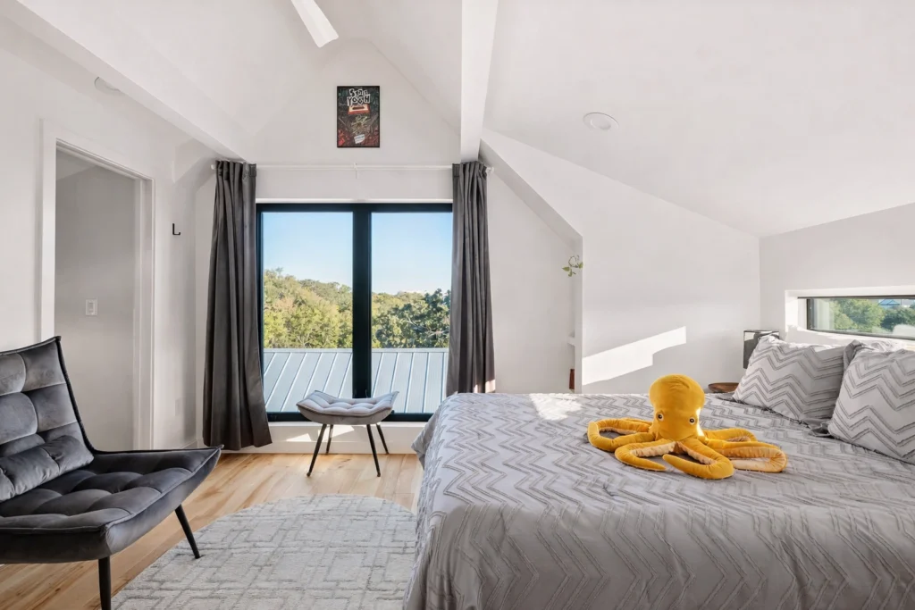 Modern guest bedroom with minimalist design and natural light