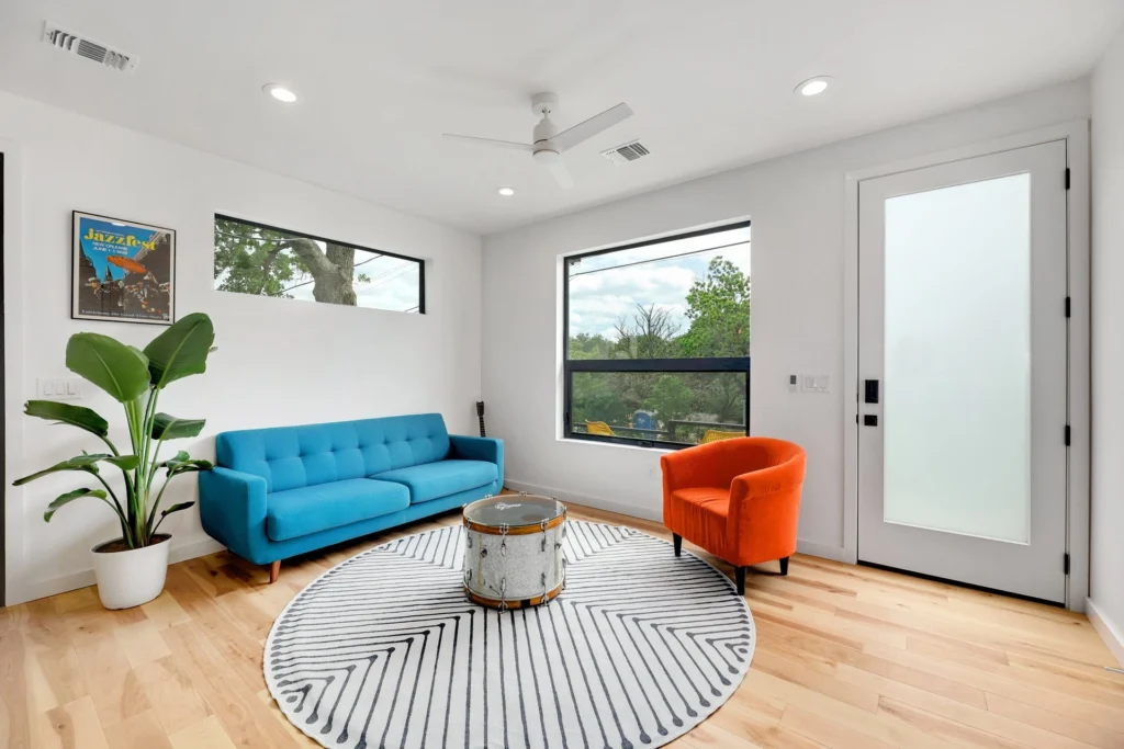 Bright modern living room with colorful furniture and natural light
