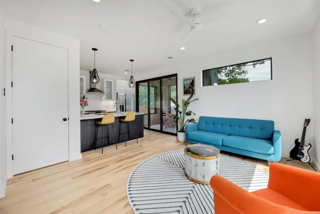 Contemporary living room with minimalist interior design and oak flooring