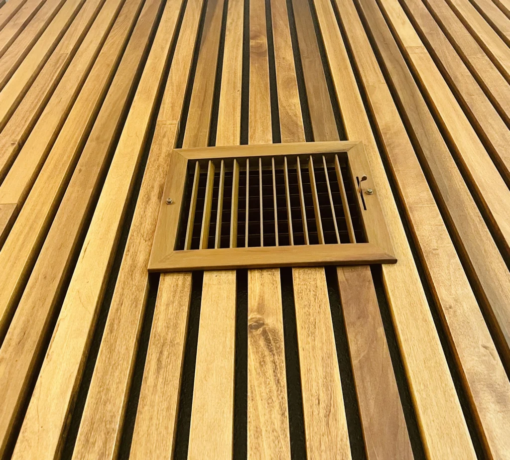 Custom wood slat wall detail with integrated vent