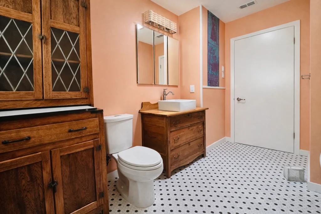 bathroom design with custom wood cabinetry and retro-inspired finishes
