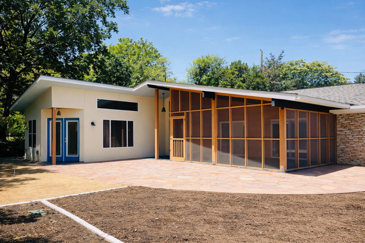 Contemporary home addition with screened patio in Austin