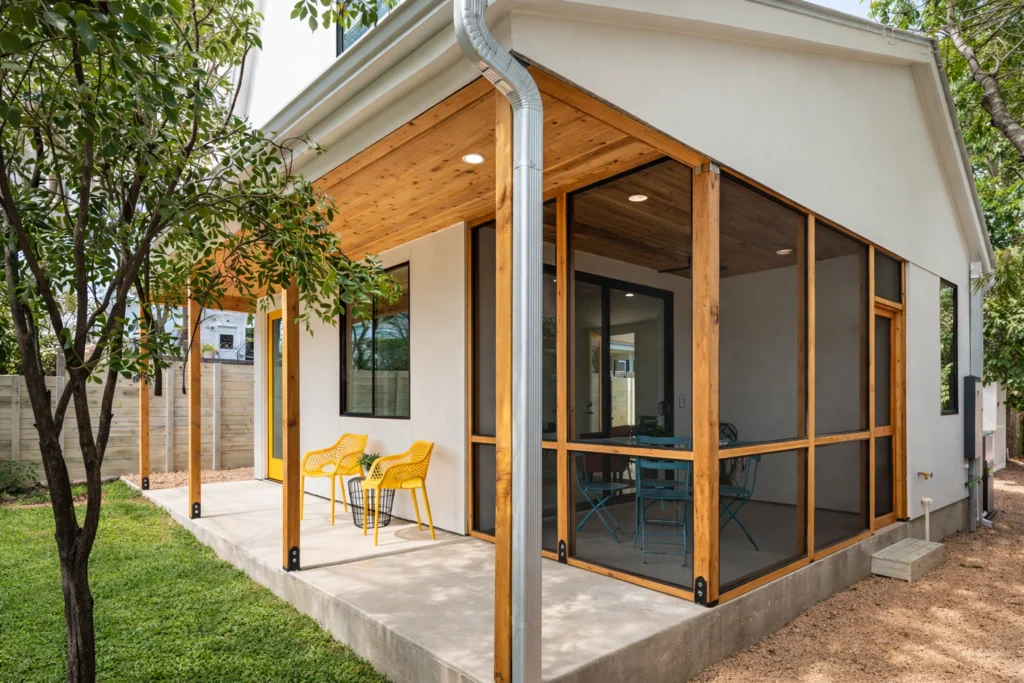 Contemporary screened patio addition with natural wood ceiling