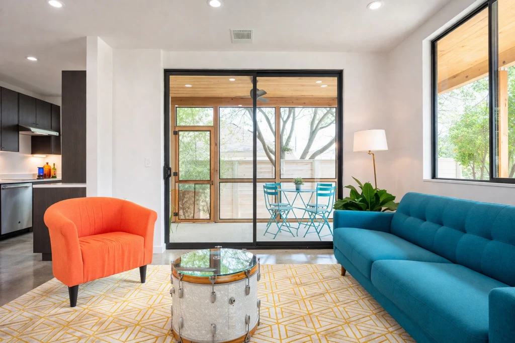 Bright open-concept living room with modern furniture and large sliding doors