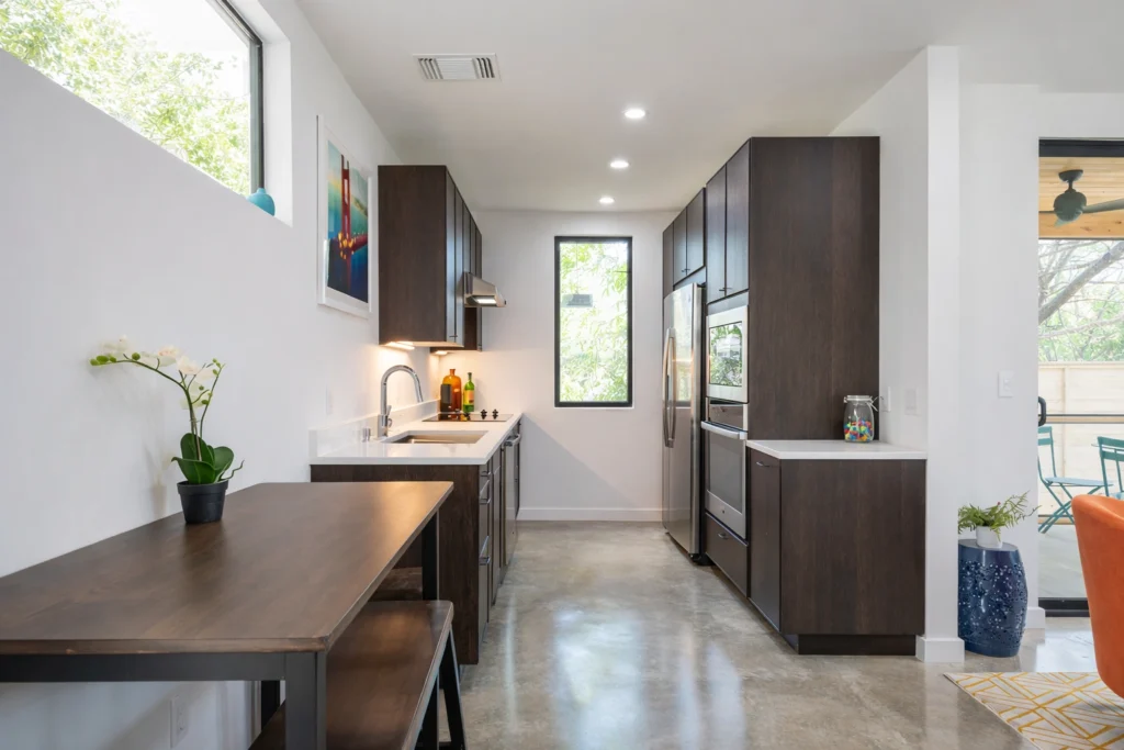 Minimalist kitchen and dining area with modern cabinetry