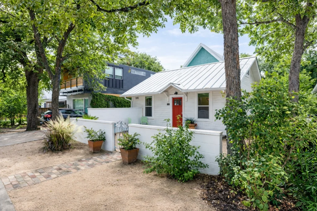 Modern cottage renovation with landscaped front yard