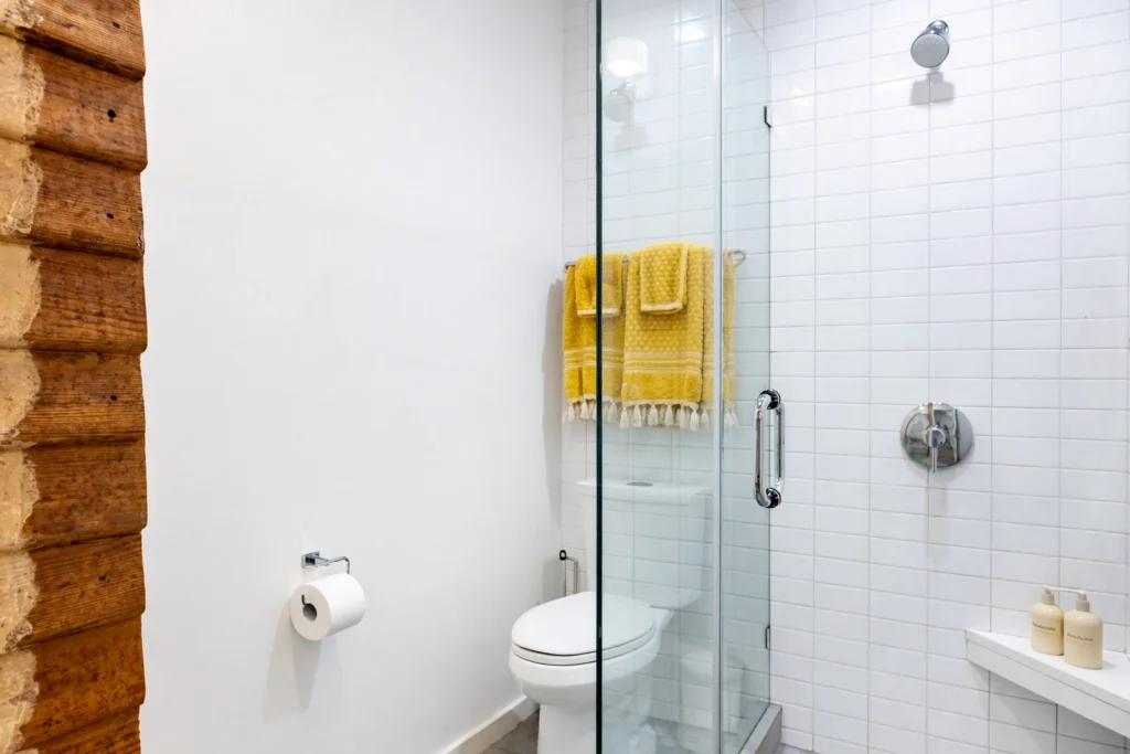 Modern bathroom with subway tile shower and glass enclosure